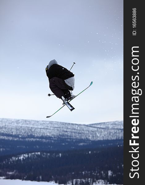 Teenage skier who jump high up in the air. Teenage skier who jump high up in the air
