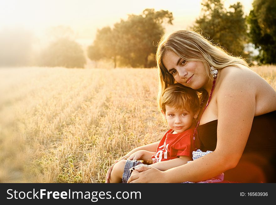 Mother and son at a crop field