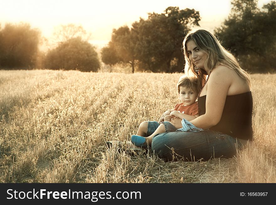 Mother And Son At A Crop Field