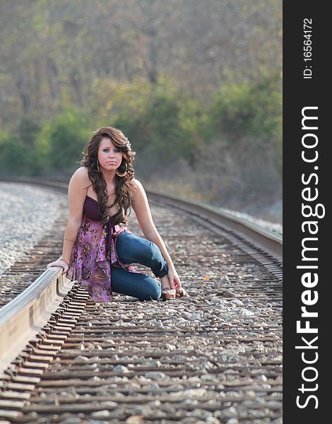 Lovely young lady on the railroad track. Lovely young lady on the railroad track.
