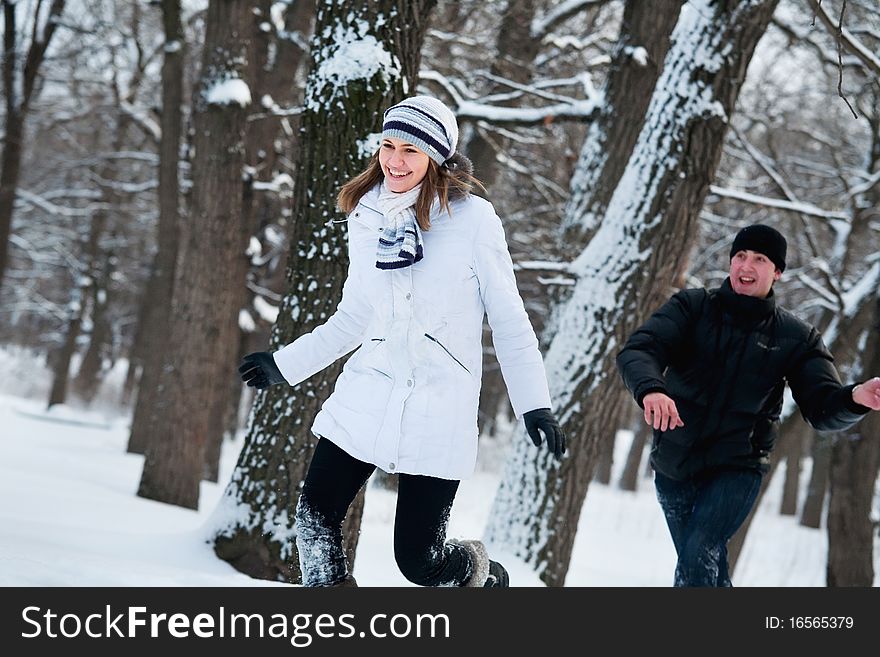 Young couple playing outdoors.