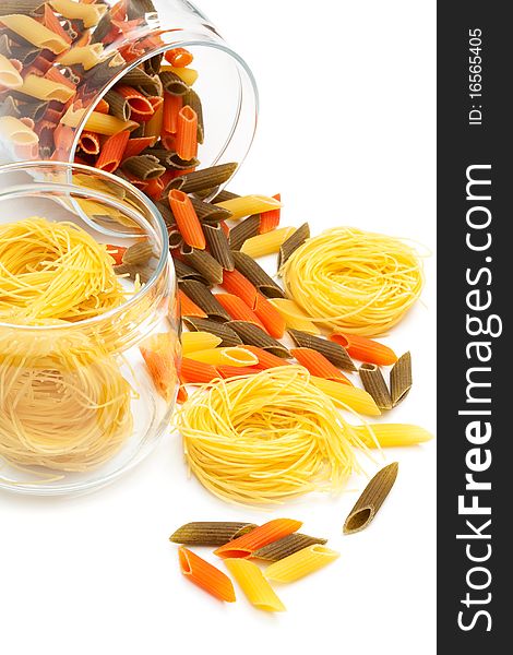 Pasta in glass jar on a white background