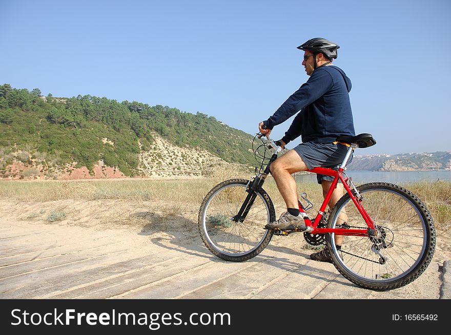 Biker in action with a beautiful landscape