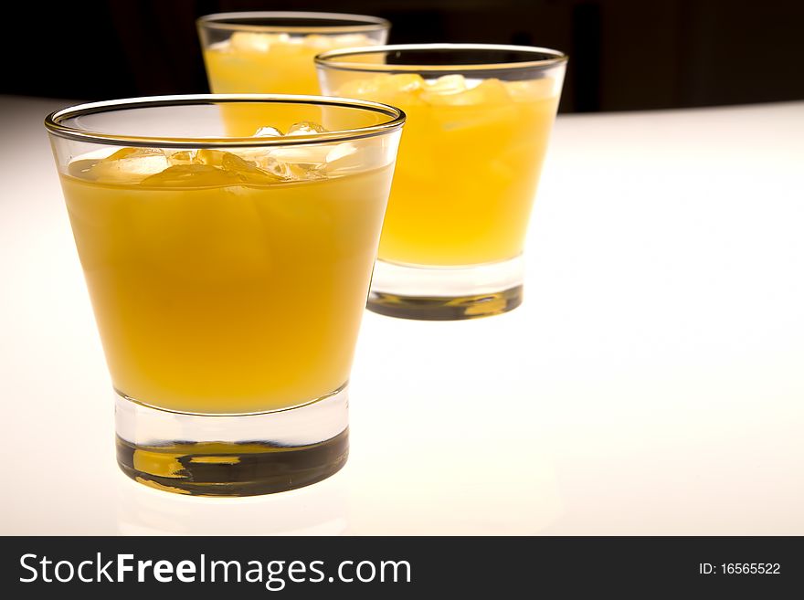 Glass of orange juice with ice