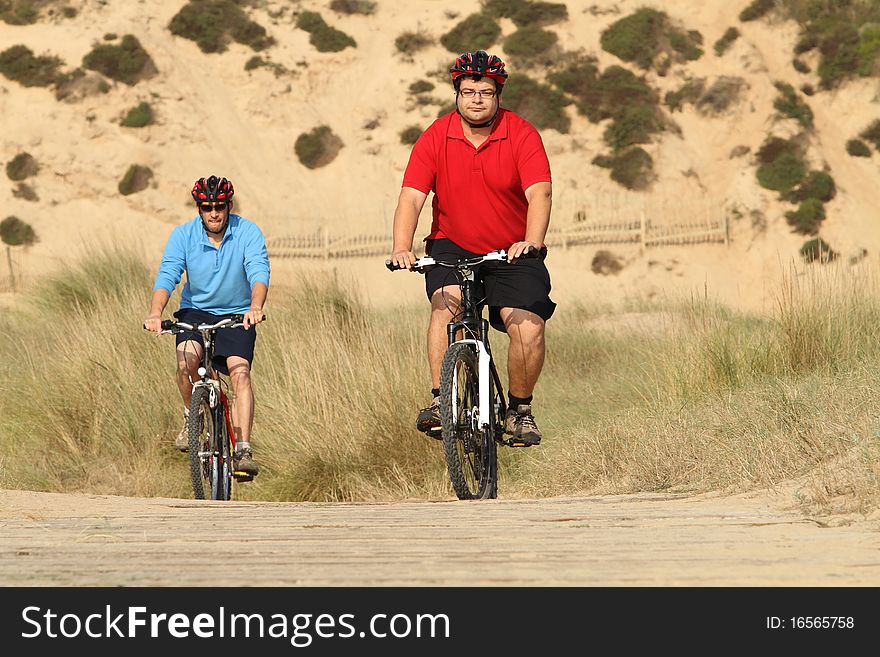 BikerÂ´s in action with a beautiful landscape. BikerÂ´s in action with a beautiful landscape