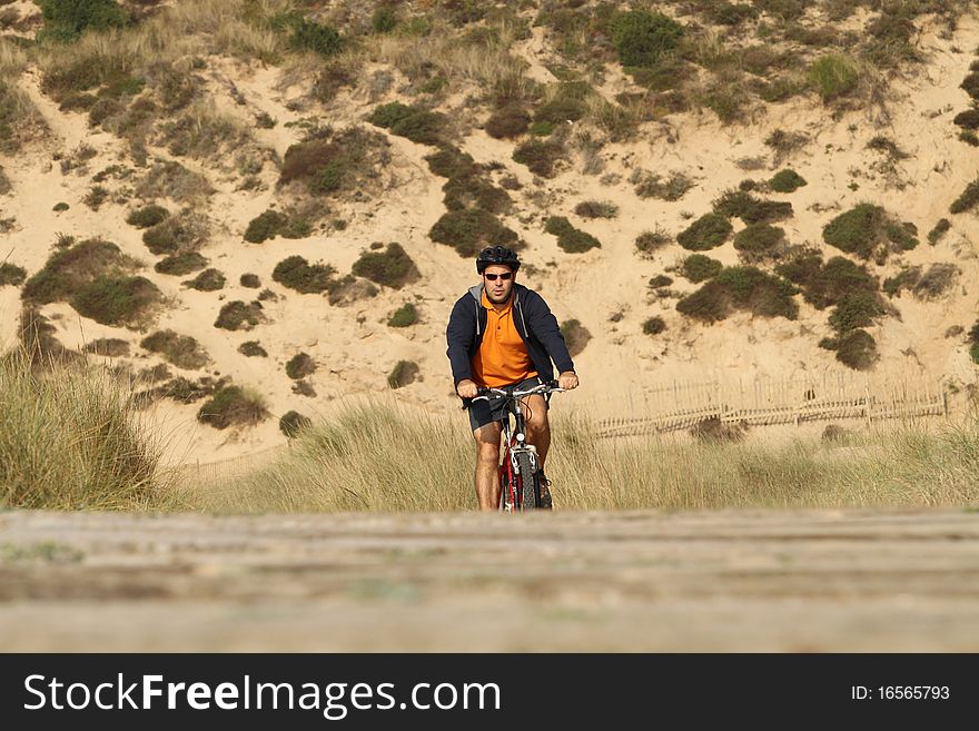 Biker in action with a beautiful landscape