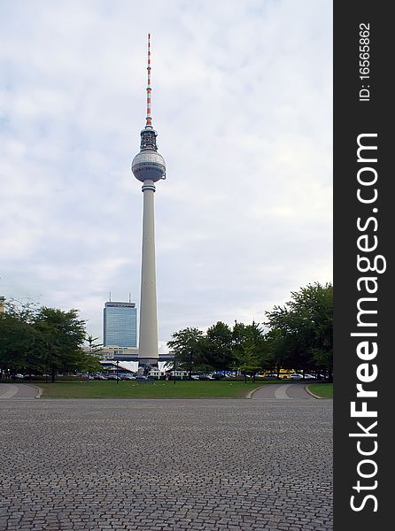 City park with a kind on the Berlin television tower