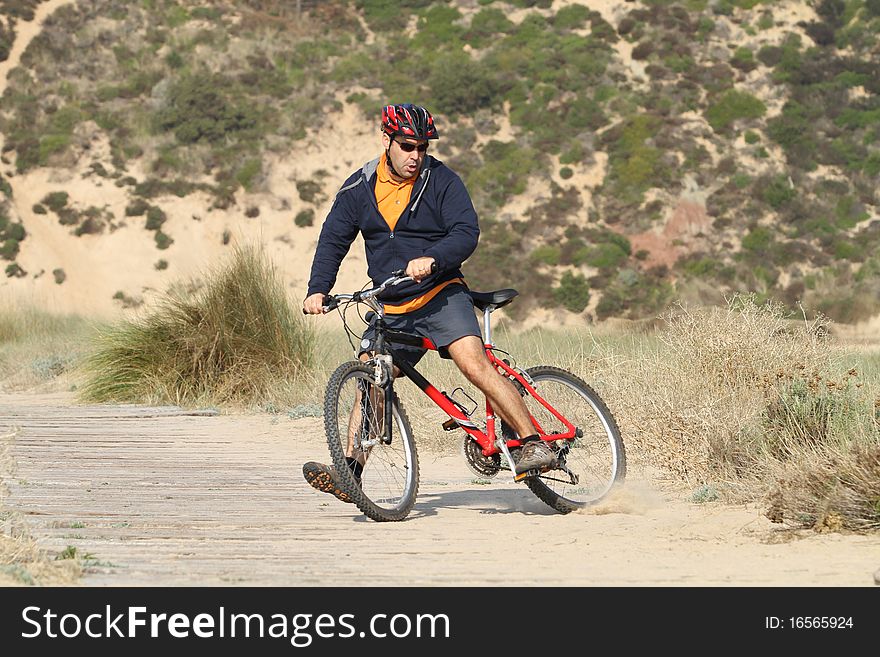 Biker in action with a beautiful landscape