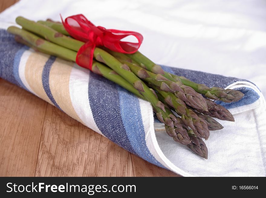 Fresh green Asparagus spears on table top