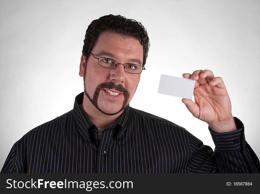 Casual man holding blank business card