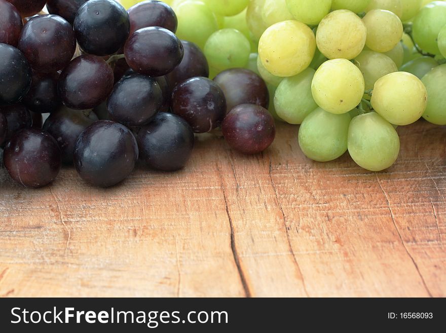 Green & Black Grapes on outdoor table. Green & Black Grapes on outdoor table