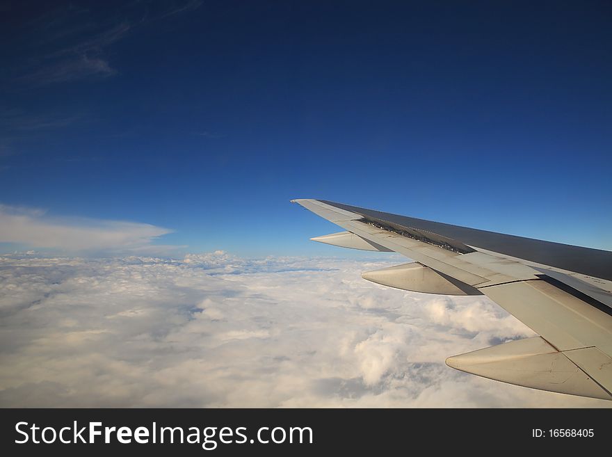 Aerial view on clouds and blue sky from airplane. Aerial view on clouds and blue sky from airplane.