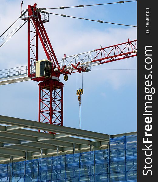 Crane in the yard of a building under construction. Crane in the yard of a building under construction