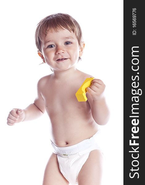 The kid plays with cubes on a white background