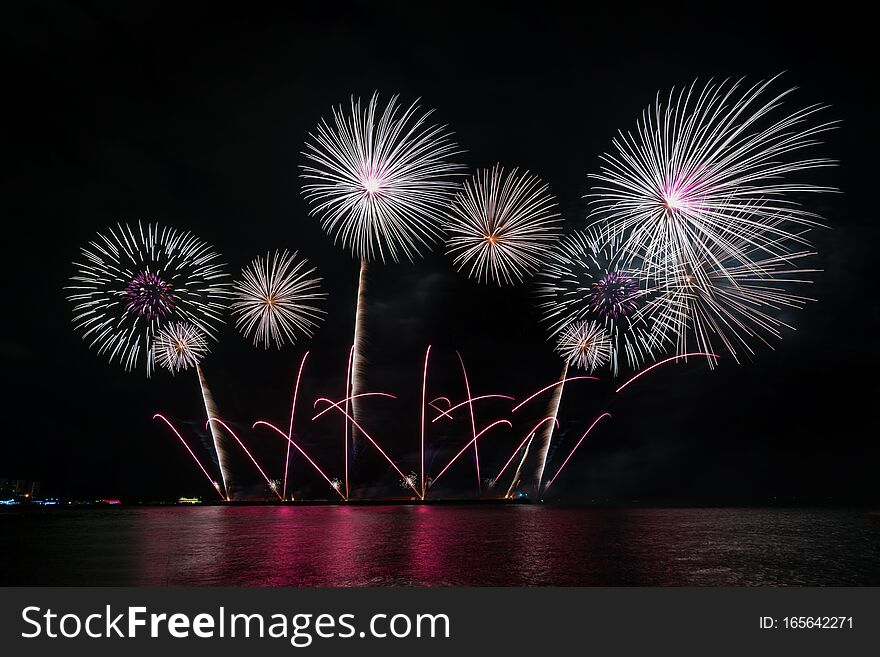 Colorful fireworks of various colors at night with celebration and anniversary concept.
