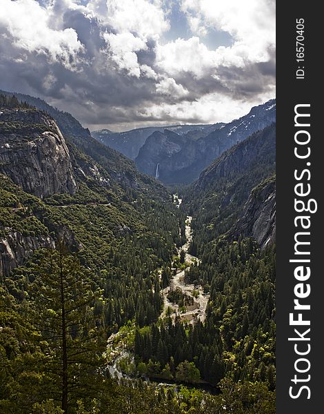 A river in Yosemite National Park running through a valley. A river in Yosemite National Park running through a valley.