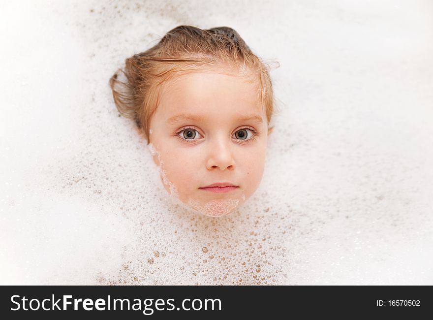 Photo of 3 years old girl having bubble bath. Photo of 3 years old girl having bubble bath