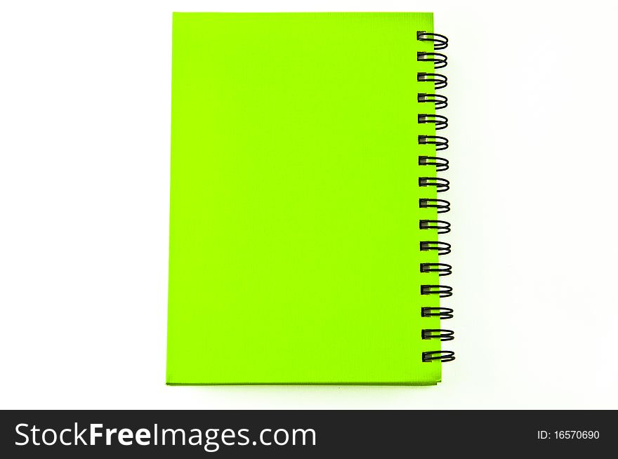 Isolated green notebook on white.