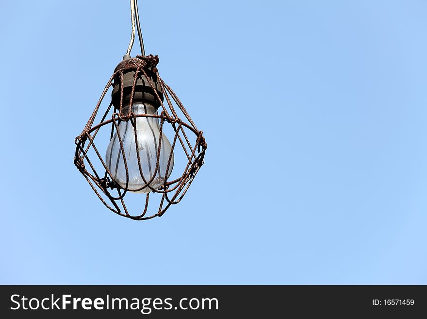 Old lamp in the blue sky