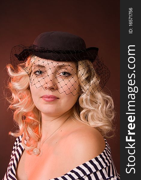 Beautiful Young Woman In A Hat With A Veil