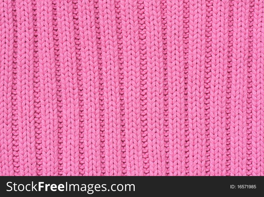 Background of knitted fabrics with warm pink things. Background of knitted fabrics with warm pink things