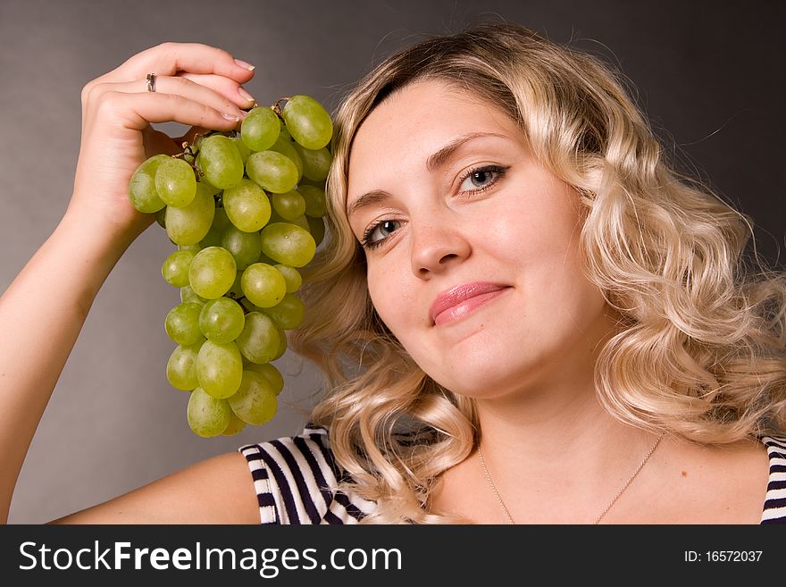 Beautiful Young Woman With The Cluster Of Vine