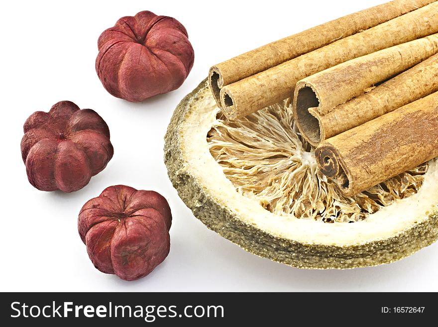 Cinnamon sticks with dried red flowers and the lemon dry. Cinnamon sticks with dried red flowers and the lemon dry.