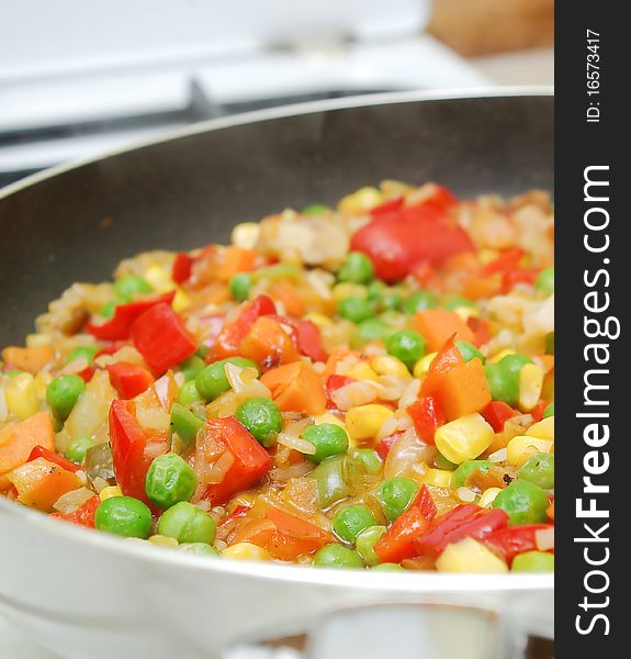 Pan With Vegetables In Kitchen