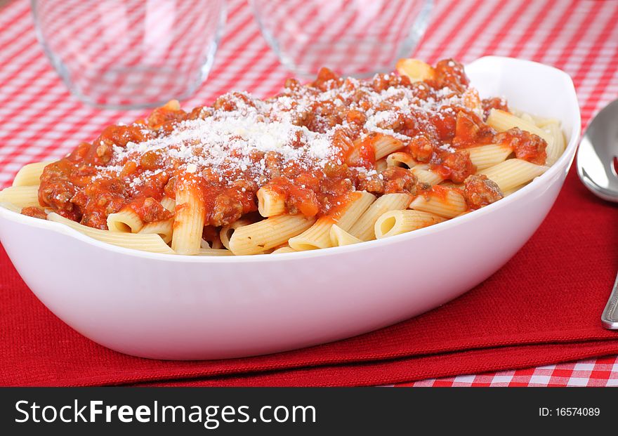 Penne pasta with tomato sauce and parmesan cheese