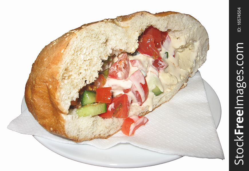 Sandwich with mayonsse and vegetables lies on plate