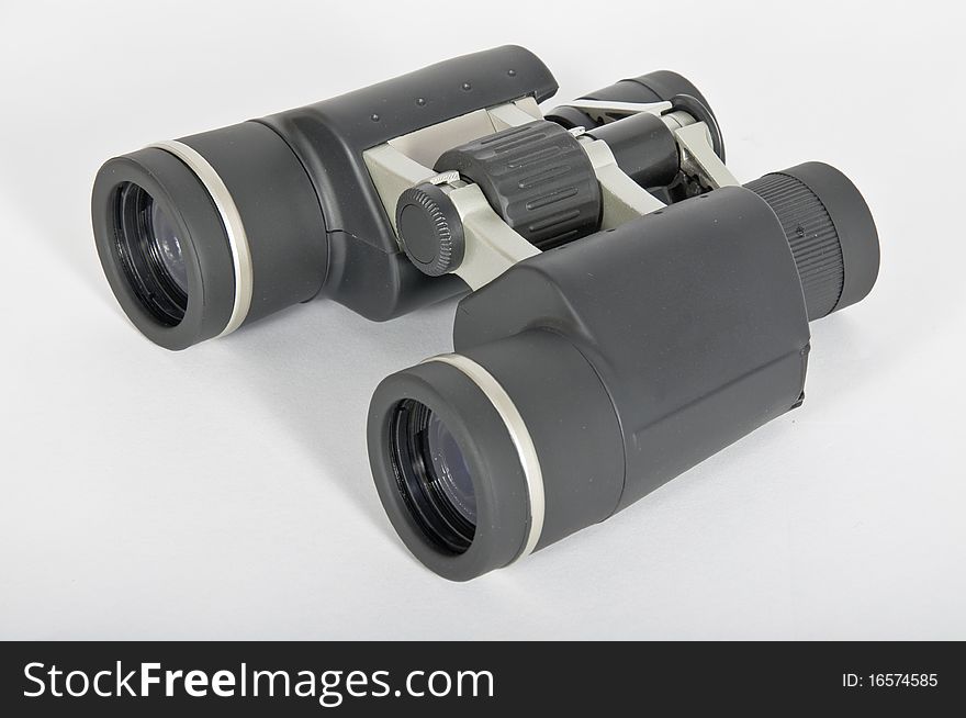 A pair of black rubber binoculars metaphor vision and ability to advance