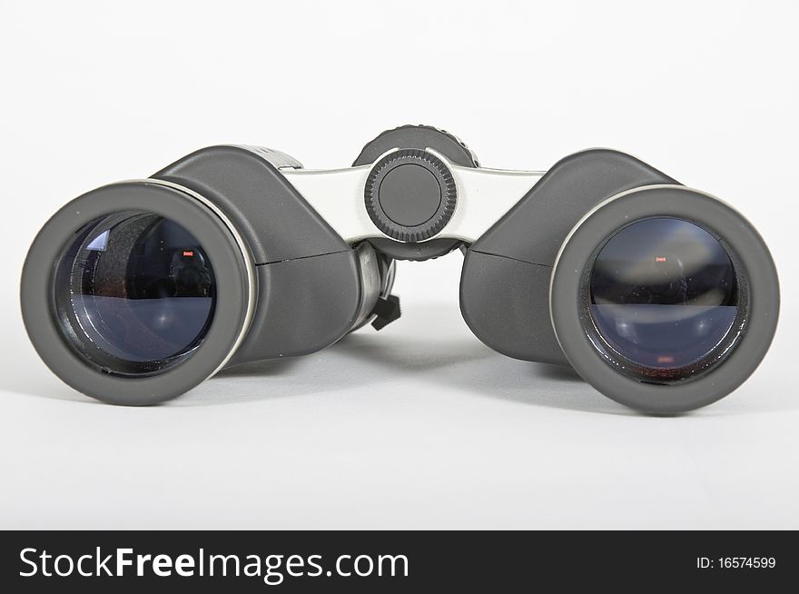 A pair of black rubber binoculars metaphor vision and ability to advance