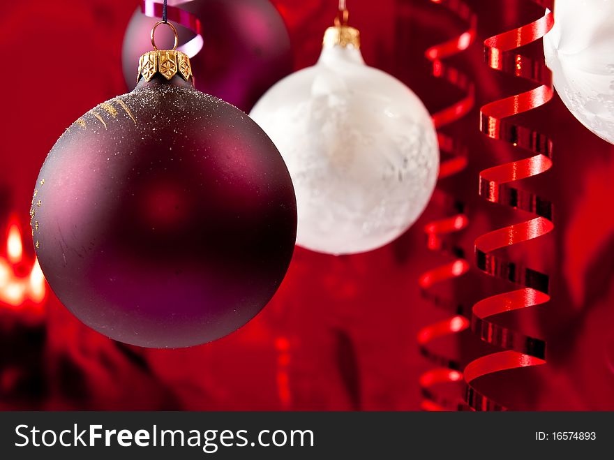 Christmas baubles and ribbons on red background. Christmas baubles and ribbons on red background