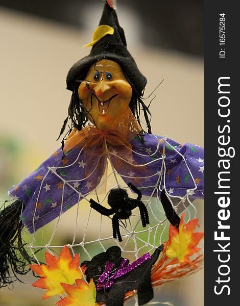 A miniature witch hung up for Halloween. A miniature witch hung up for Halloween