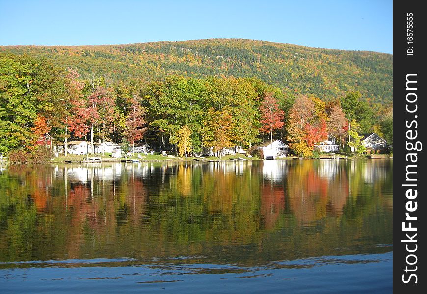 Beautiful reflections of the fall foliage is a perfect mirror image on a fall afternoon at Lake Dunmore. Beautiful reflections of the fall foliage is a perfect mirror image on a fall afternoon at Lake Dunmore.