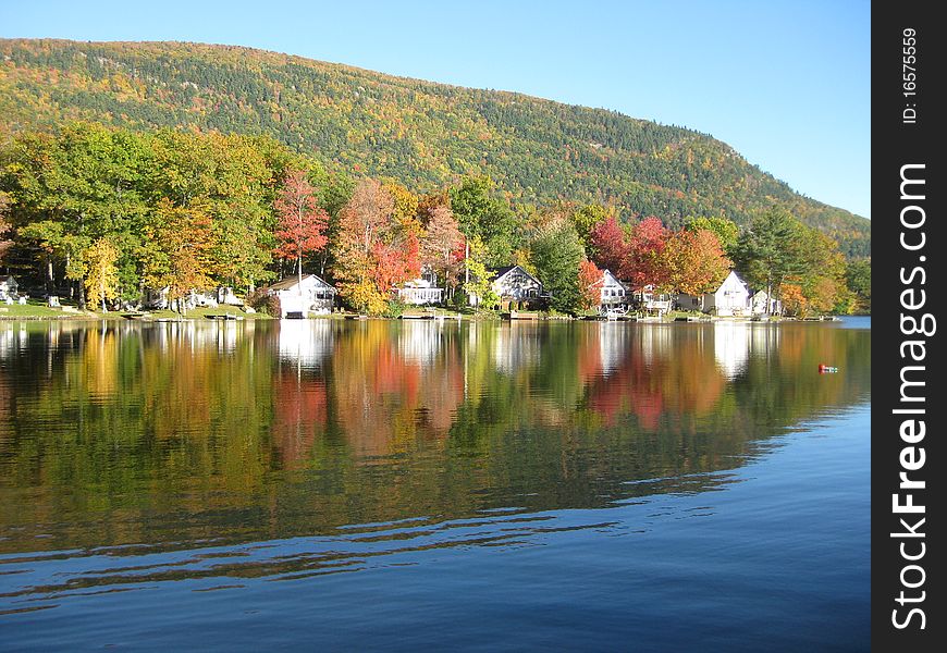 The fall foliage reflections on Lake Dunmore are a perfect mirror image on a sunny day. The fall foliage reflections on Lake Dunmore are a perfect mirror image on a sunny day.