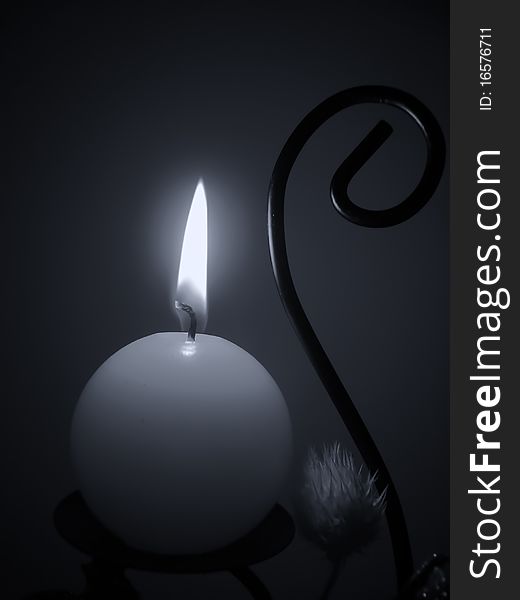 Abstract candle burning in the dark