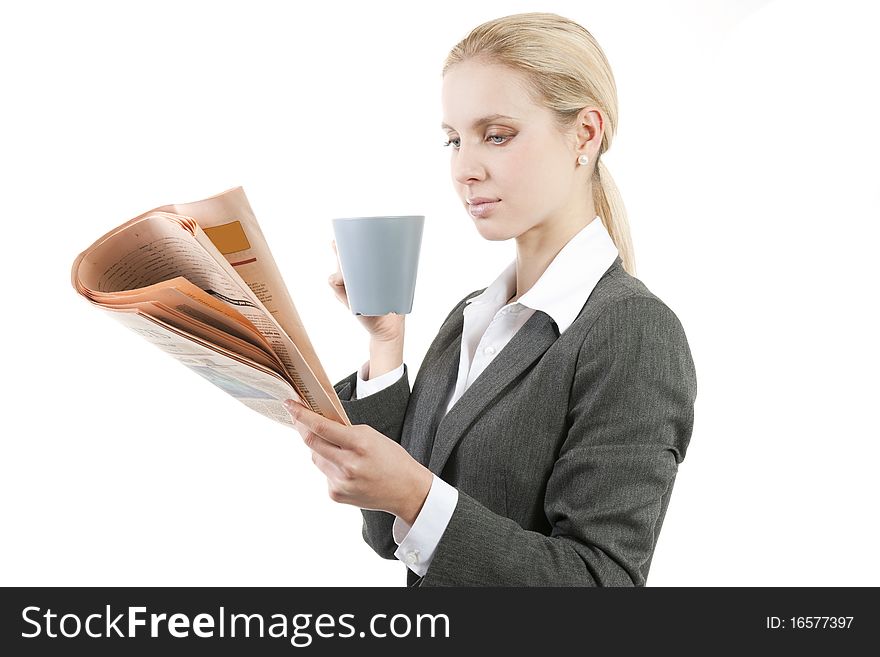 Relaxed businesswoman with coffee and newspaper. Relaxed businesswoman with coffee and newspaper