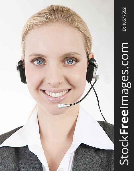 Businesswoman Talking On Headphones