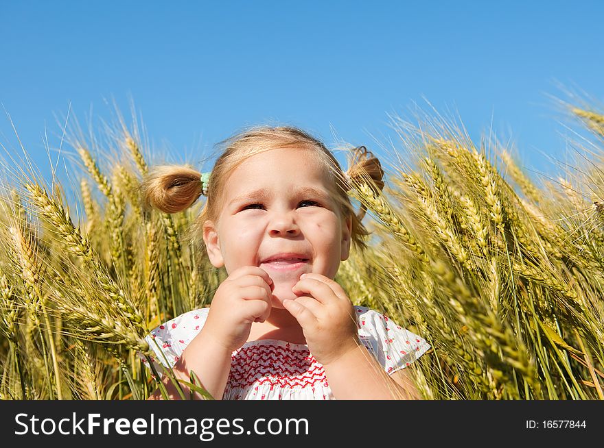 Laughing Kid In Sunny Wheat Field