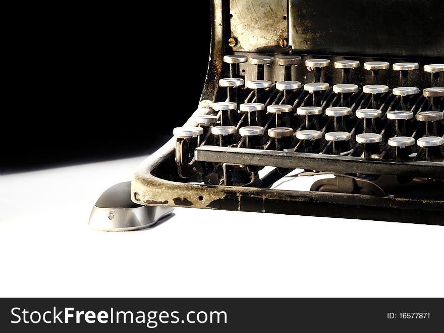 A photography of very old and ruined typewriter with computer mouse. A photography of very old and ruined typewriter with computer mouse.