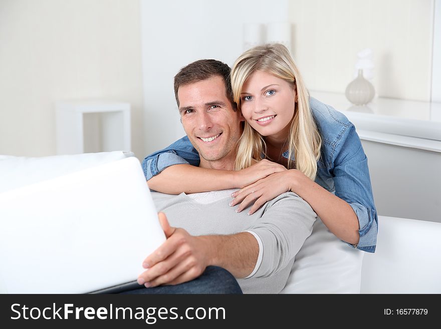 Couple relaxing in sofa