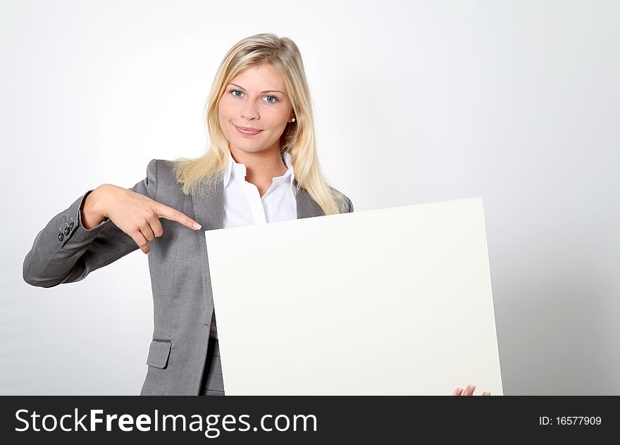 Businesswoman looking at white panel. Businesswoman looking at white panel