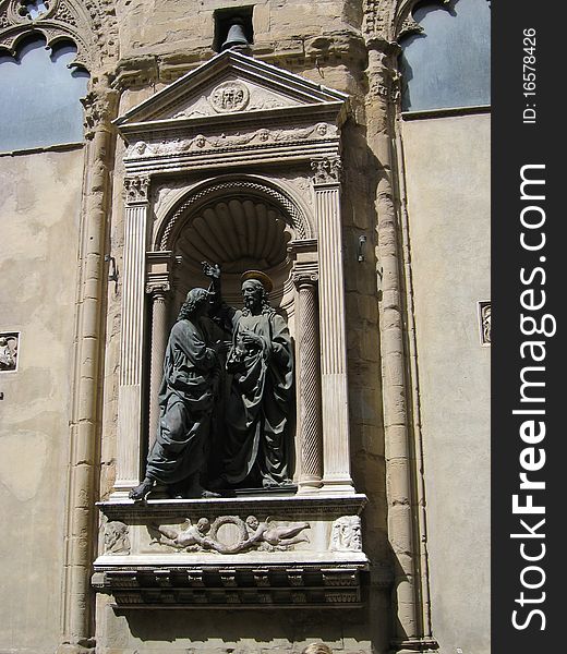 Bronze sculpture of Christ in the niche