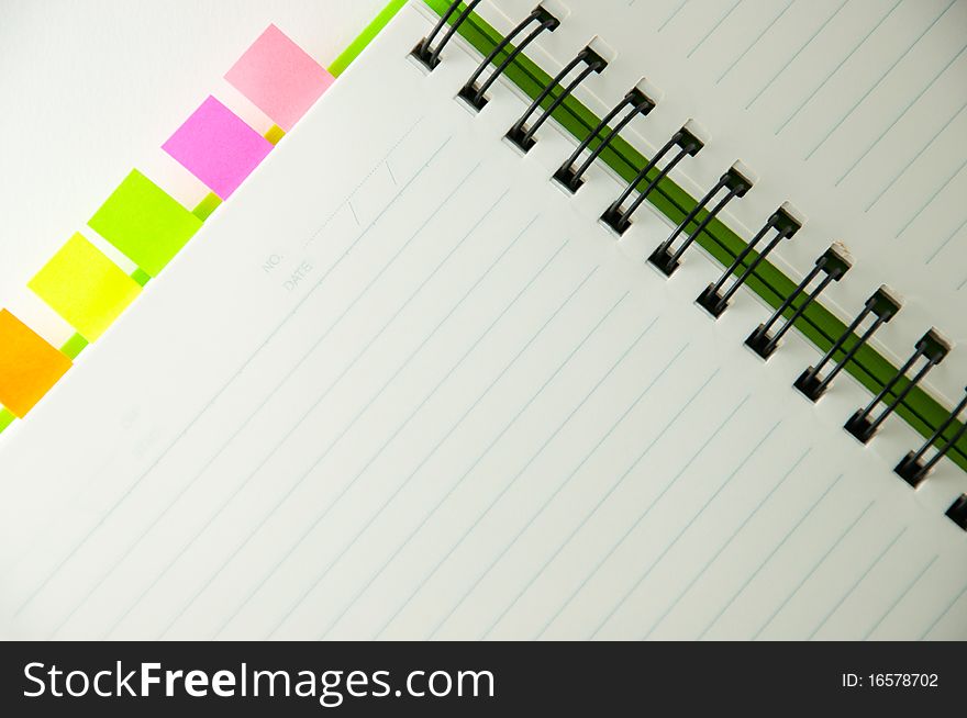 Isolated green notebook on white.