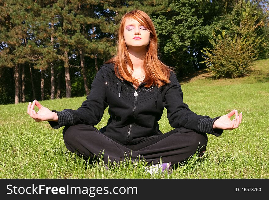 Girl meditating in nature