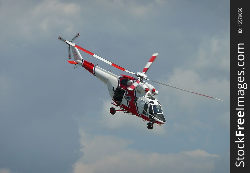 A rescue helicopter flying in clouds