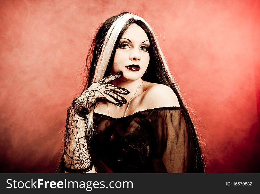 Gothic girl on smoke background