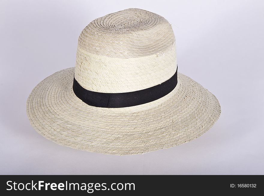 This image shows a simple hat with a black ribbon with white background