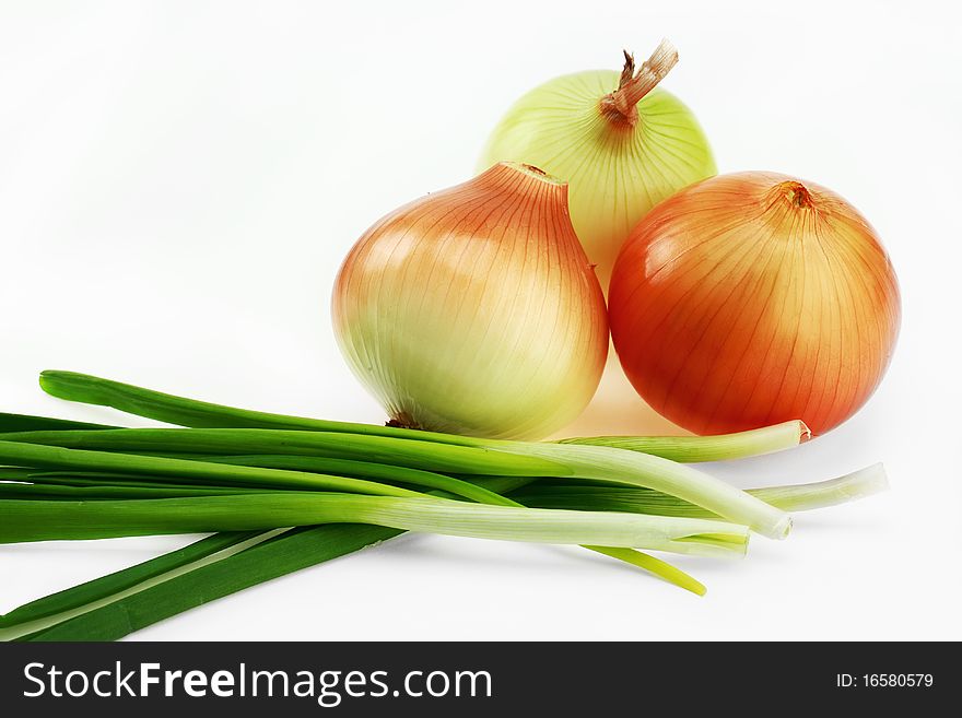 Fresh bulbs of onion on a white background